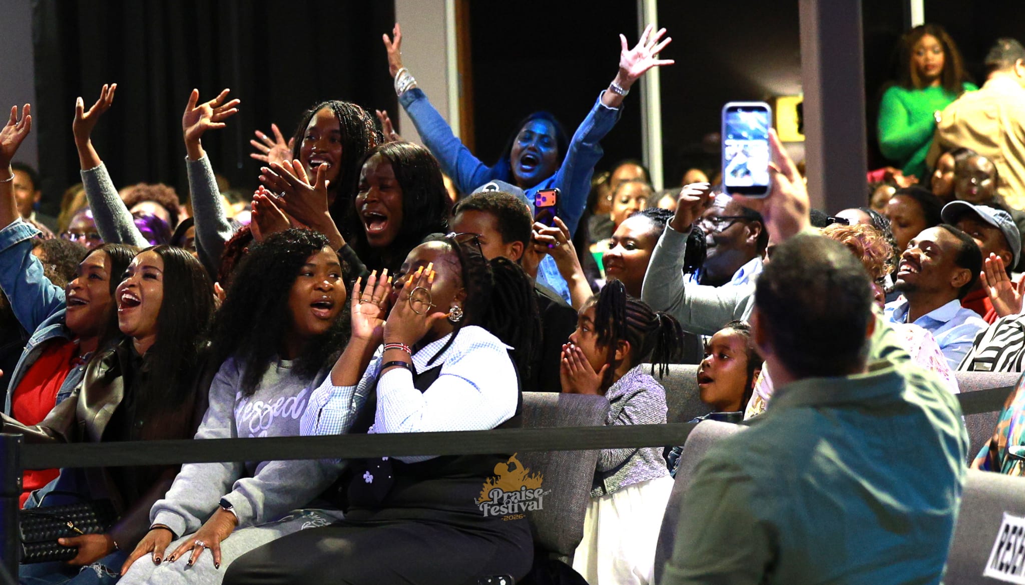 Audience singing along at an Angaza Music event